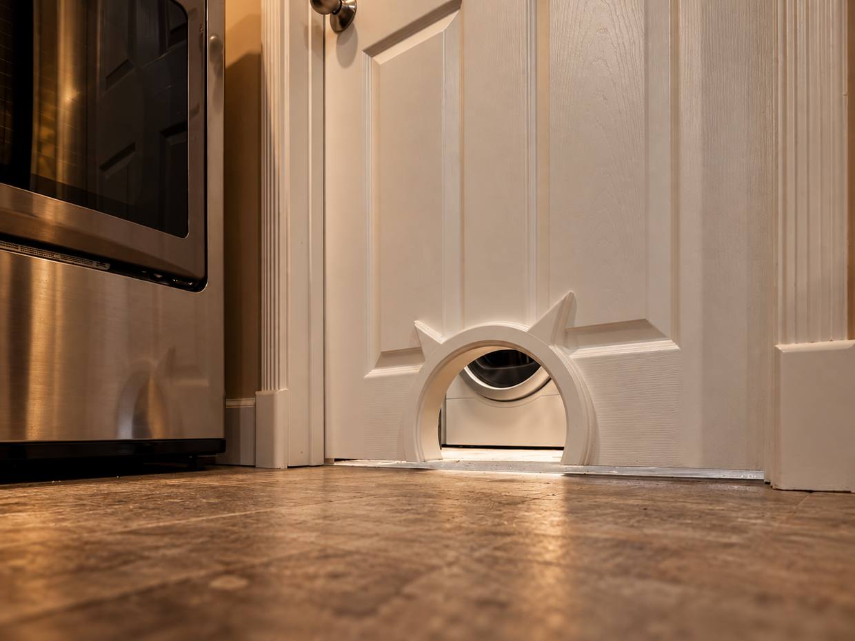 Built-in pet door in custom cabinetry