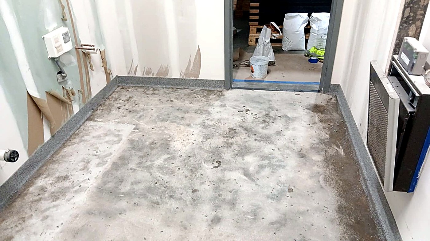 Bare concrete room floor before epoxy