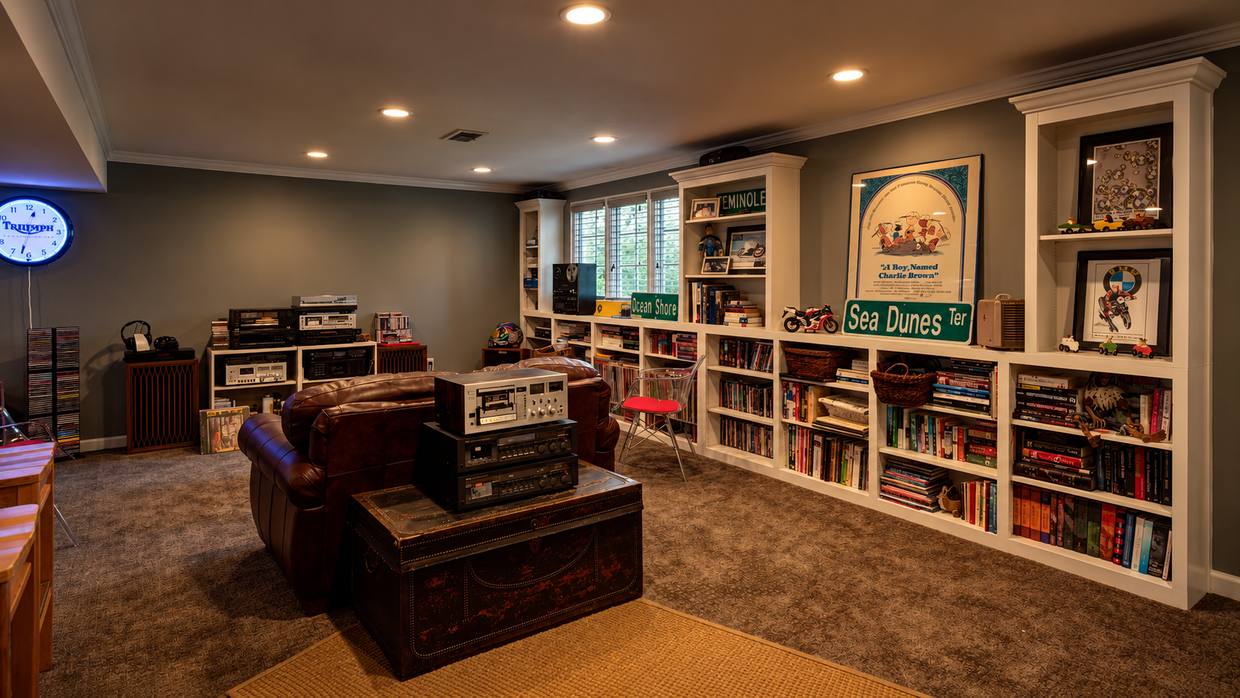 Rec room with built-in bookshelves