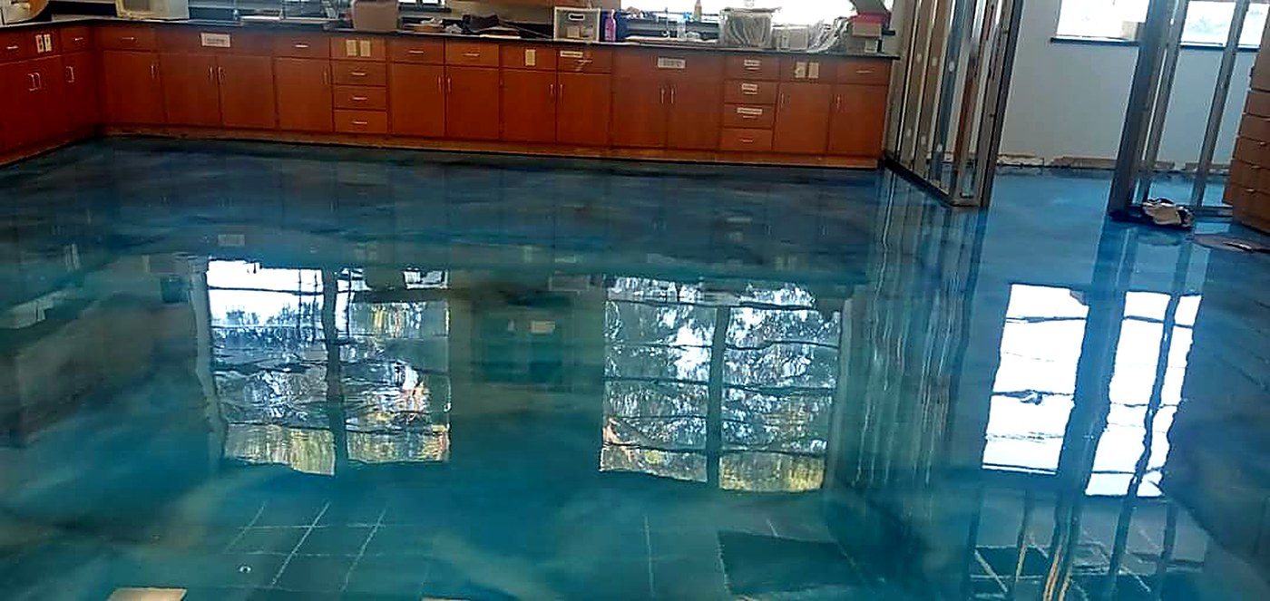 Blue metallic epoxy floor in a commercial space