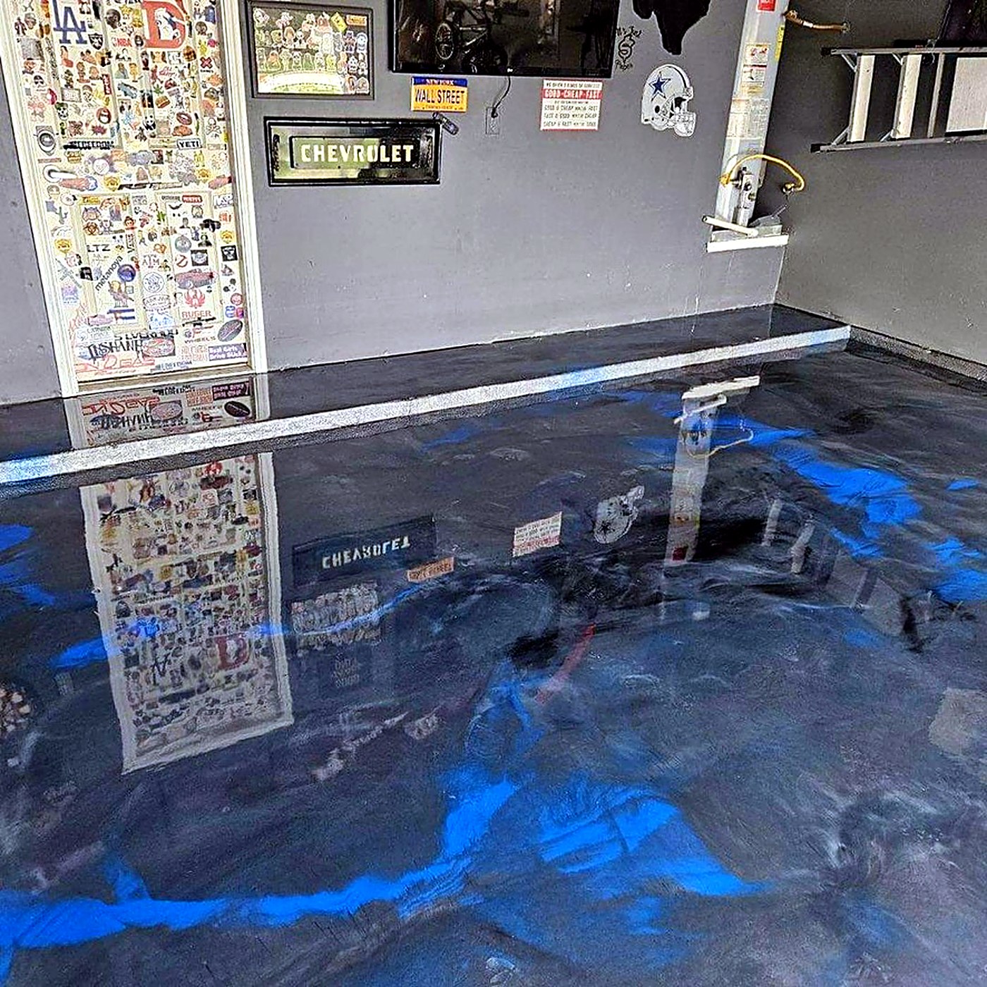 Blue and black metallic epoxy garage floor